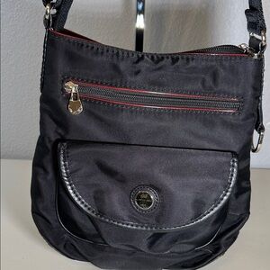 Elegant Black Crossbody Bag with Red Details